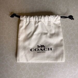 Coach Mini Cream and Black Drawstring Bag